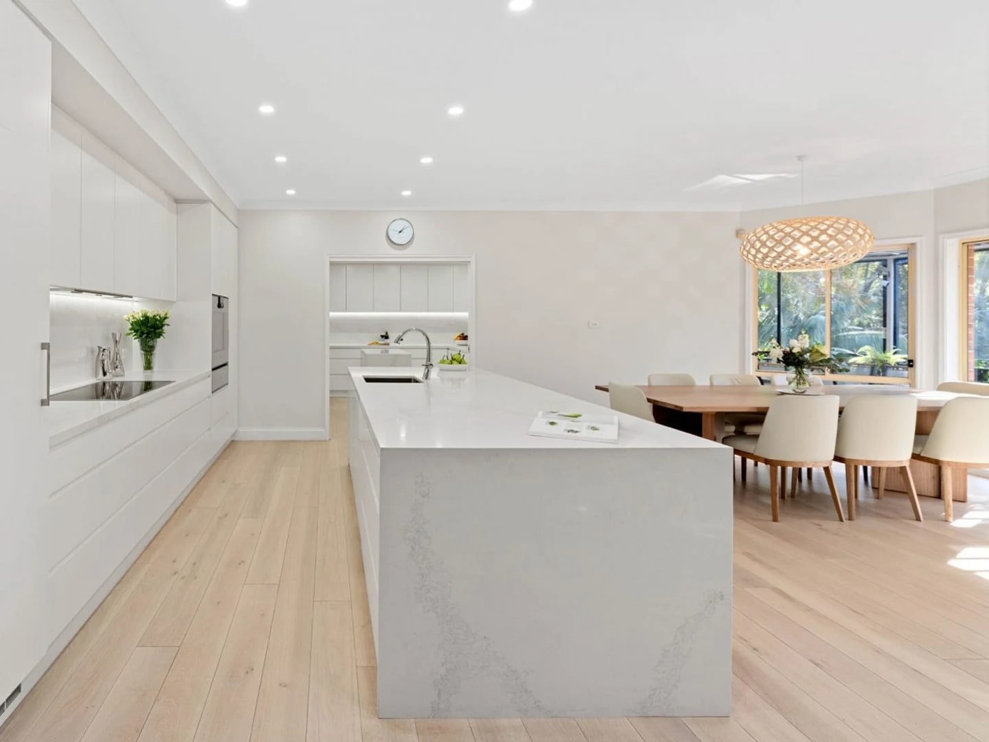 Light and airy modern kitchen featuring HW12342 Maison.